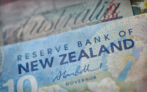 NZ dollar sliding, RBNZ expected to pause